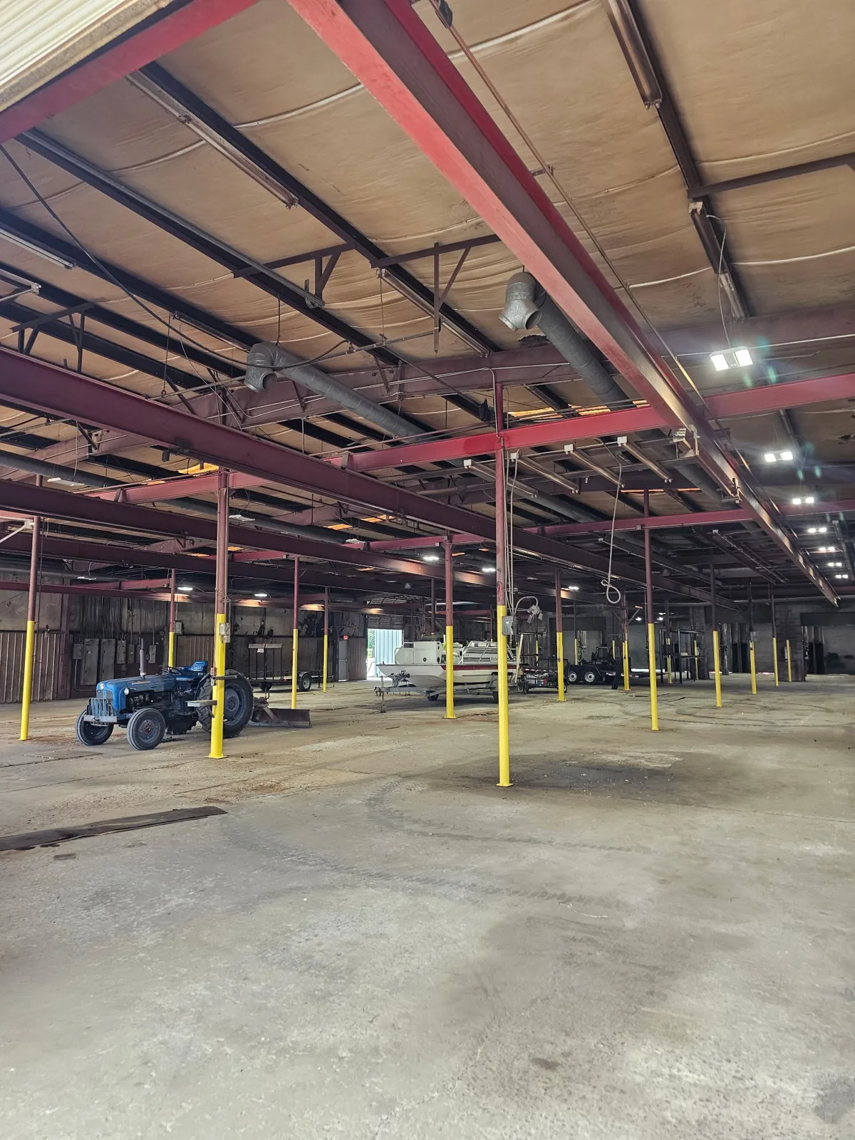 Wide view of the warehouse floor with steel columns
